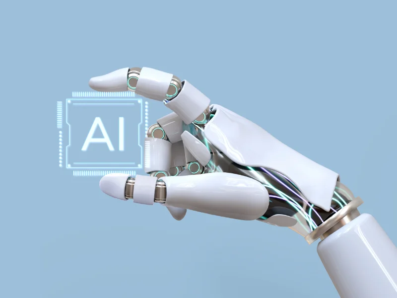 Mano robótica sosteniendo chip con letras AI, representación de inteligencia artificial aplicada a franquicias