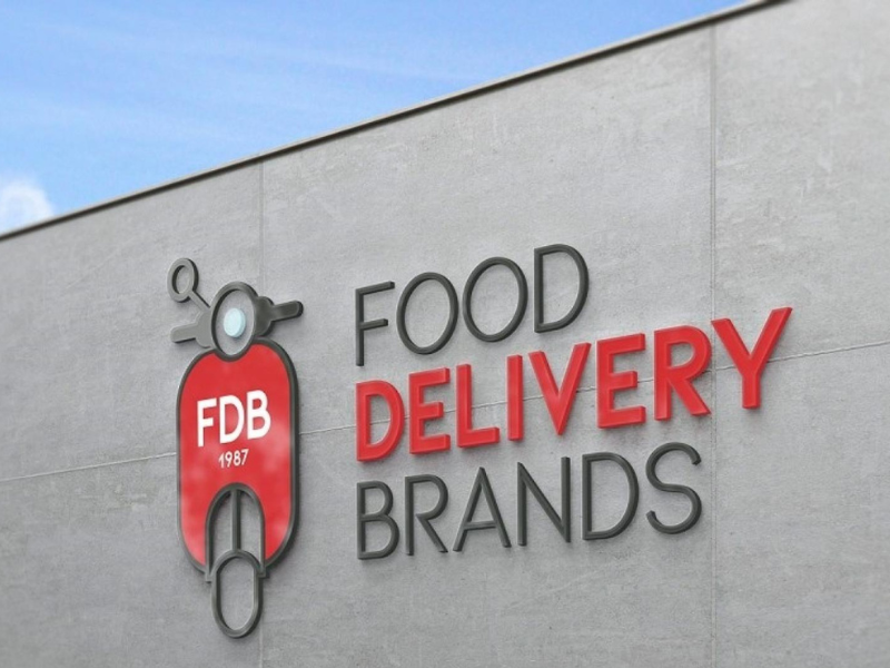 Logo y edificio de Food Delivery Brands